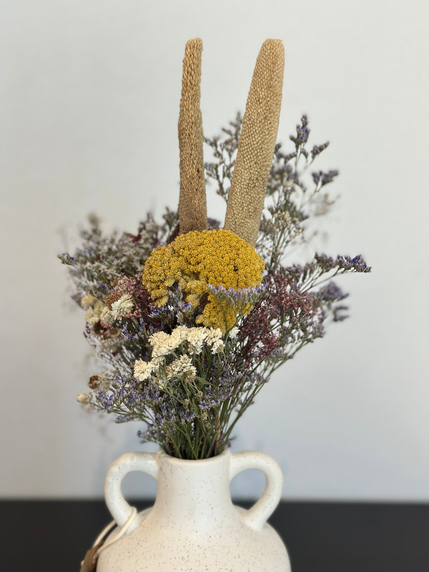 White vase and flowers