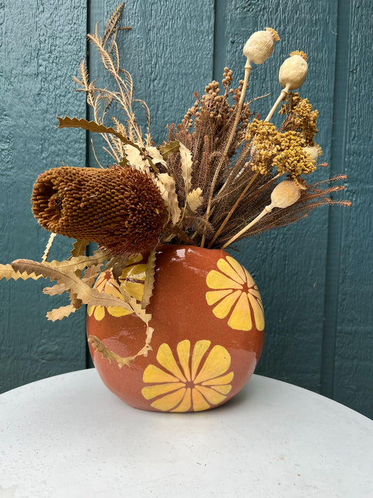 Floral- Large red clay flower vase with yellow, peach sun bursts.  With dried flowers. - 1