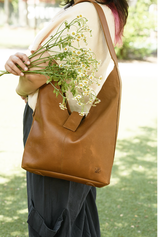 65b2bb63f348b87cbe1f70aa_bindle-bag-cognac-ed_1767824313973.png
