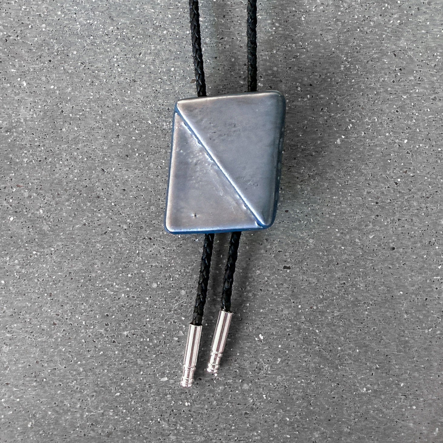 65b2bb63f348b87cbe1f70aa_clover-maven-13-glass-bolo-tie-gray-black-cord-silver-tips_1784392206759.jpg