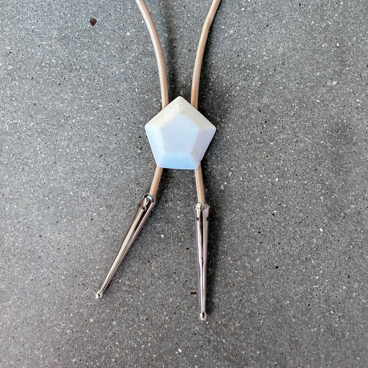 65b2bb63f348b87cbe1f70aa_clover-maven-24-glass-bolo-tie-white-gem-tan-cord-silver-tips_1784393137768.jpg