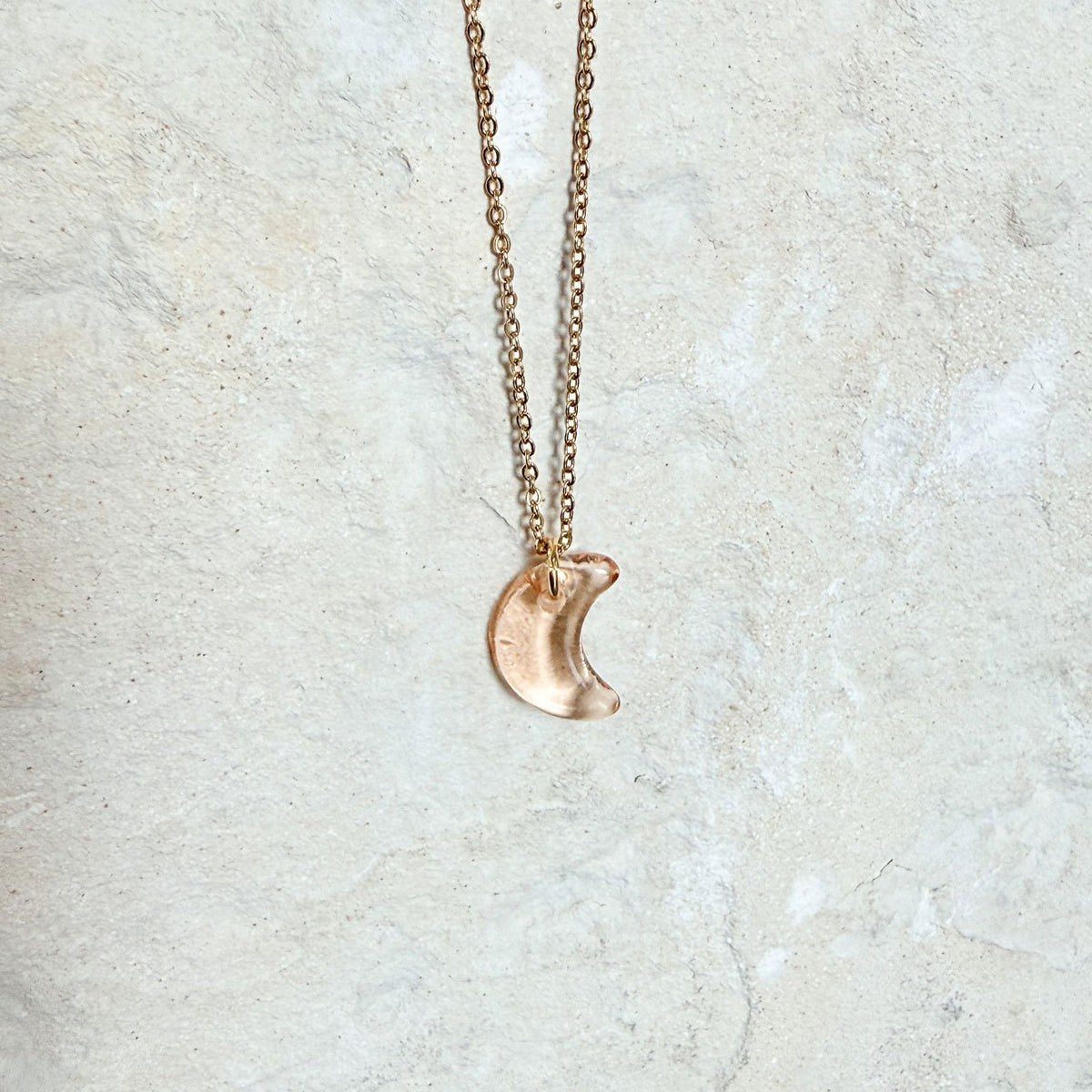 65b2bb63f348b87cbe1f70aa_clover-maven-51-glass-charm-crescent-moon-peach-gold-necklace_1784396183899.jpg