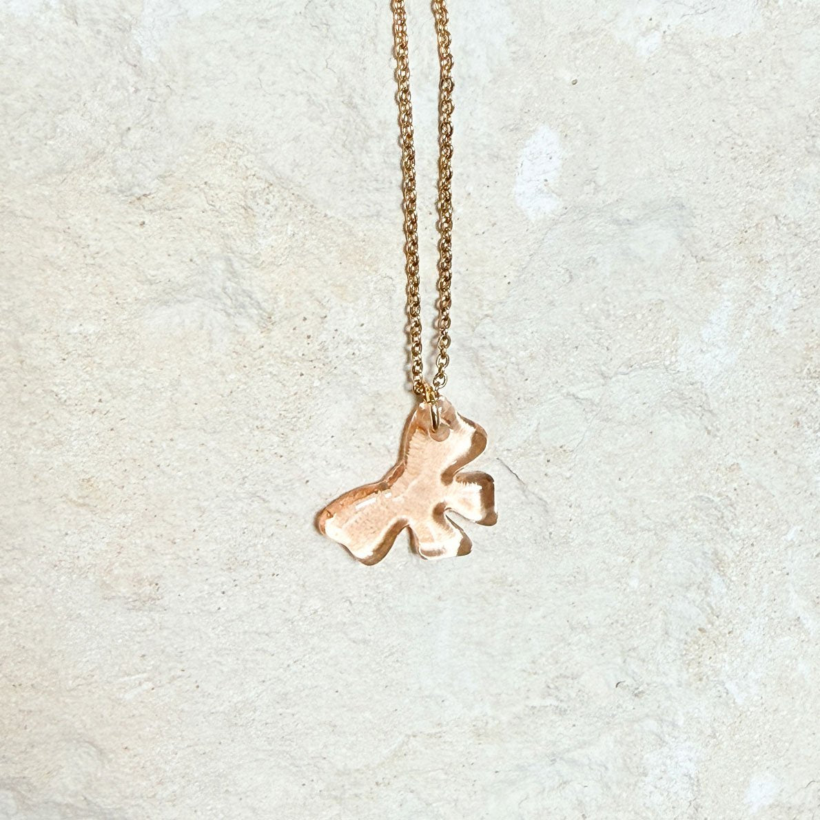 65b2bb63f348b87cbe1f70aa_clover-maven-52-glass-charm-bow-peach-gold-necklace_1784396183900.jpg
