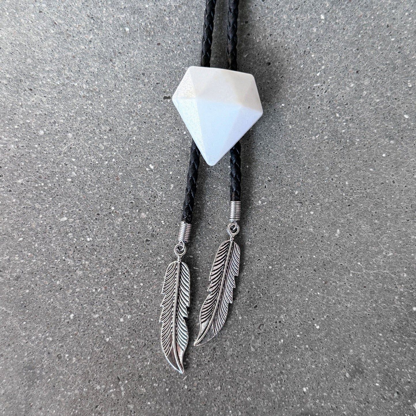 65b2bb63f348b87cbe1f70aa_clover-maven-7-glass-bolo-tie-white-gem-black-cord-silver-tips_1784393137768.jpg