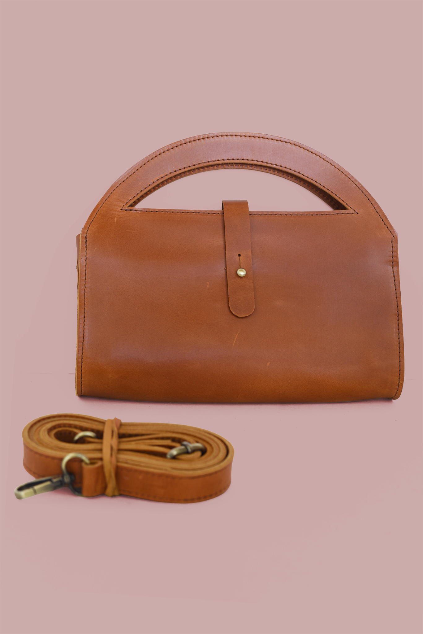 65b2bb63f348b87cbe1f70aa_clutch-cb-brown_1780337167340.png