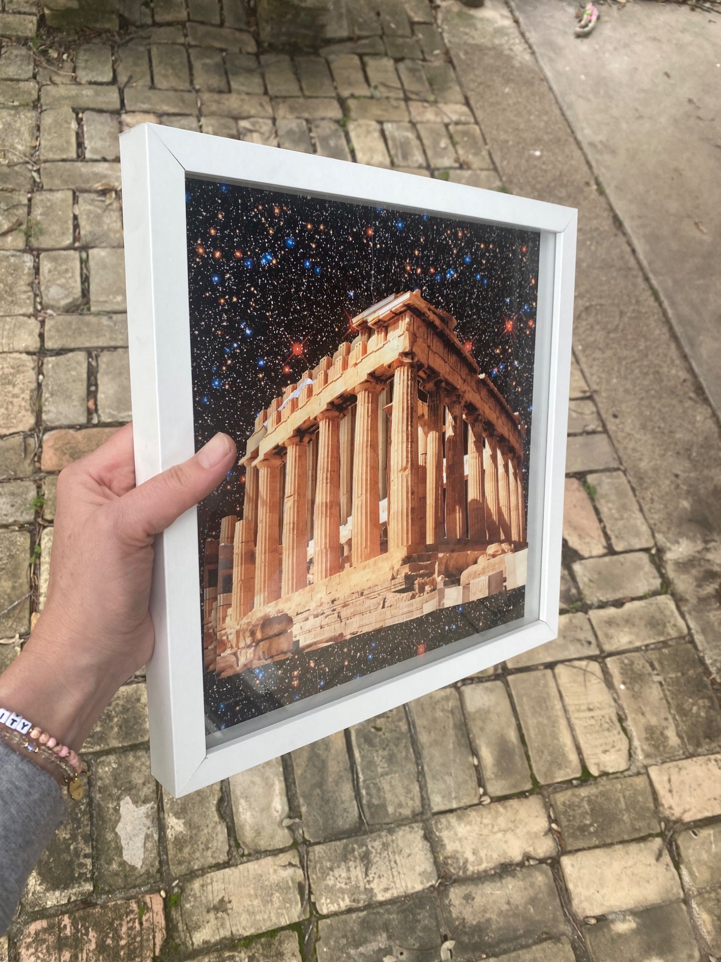 65b2bb63f348b87cbe1f70aa_shadow-box-parthenon-in-space_1757432373612.jpg