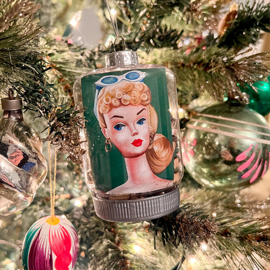 65b2bb63f348b87cbe1f70aa_vintage-barbie-head-ornament-square_1765433356610.jpg
